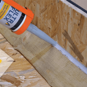 An image of Ultraflex Sealant Trim Adhesive and gap filler being appplied to a wooden join.
