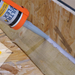 An image of Ultraflex Sealant Trim Adhesive and gap filler being appplied to a wooden join.