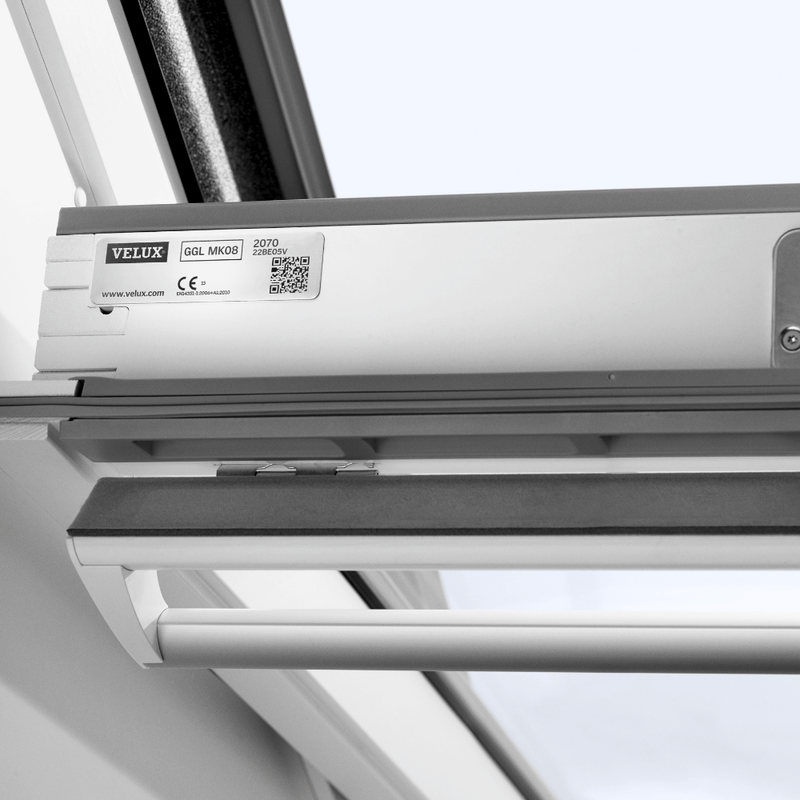 An image showing a VELUX White-Painted Centre-Pivot Window and showing the top handle where it can be operated from.