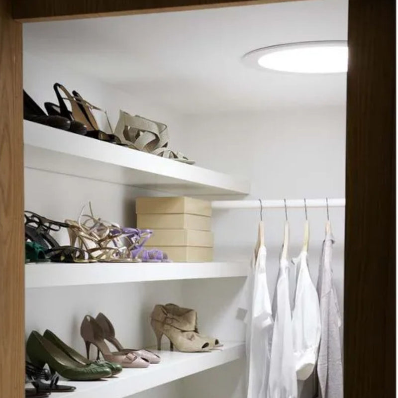 An image of what a TLR 0K14 2010 VELUX 14" Rigid Sun Tunnel would look like from the inside of a storage room