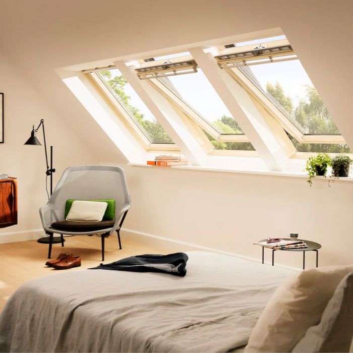 An image of a Velux Pine GGL 3068 MK27 CPivot window in the size 780 X 620. The window demonstrates how it opens by pivoting from the middle.