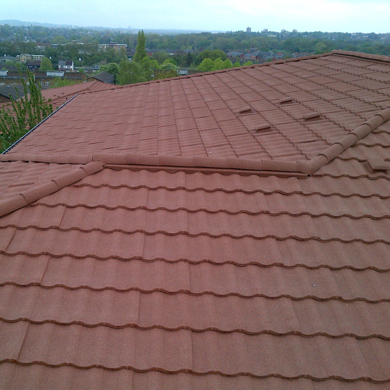 An image showing a roof with Villatile Lightweight Roofing with Ridge Closures 