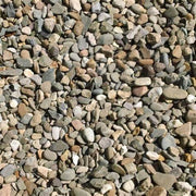 An image of aggregates in the colour Welsh Brown, can be used as drainage gravel. They are 20mm in size. They are a mix of brown and grey tones and are very natural looking.