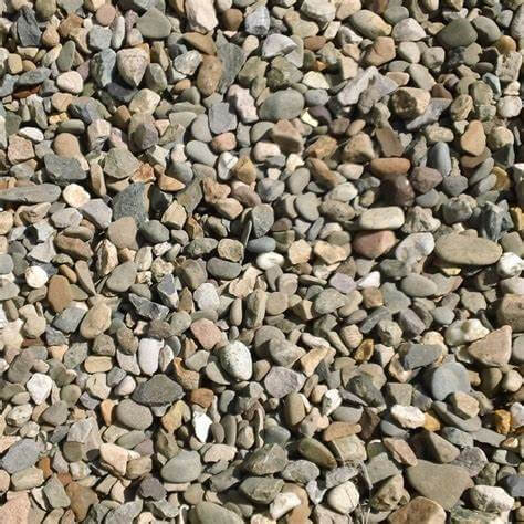 An image of aggregates in the colour Welsh Brown, can be used as drainage gravel. They are 20mm in size. They are a mix of brown and grey tones and are very natural looking.