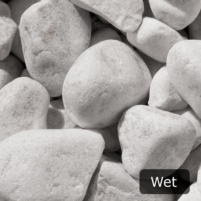 An image of White Cobbles 40-90mm and what they look like when wet