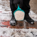 Image of White Rock Salt in a small scoop ready to be spread onto a footpath to show how it can be used.