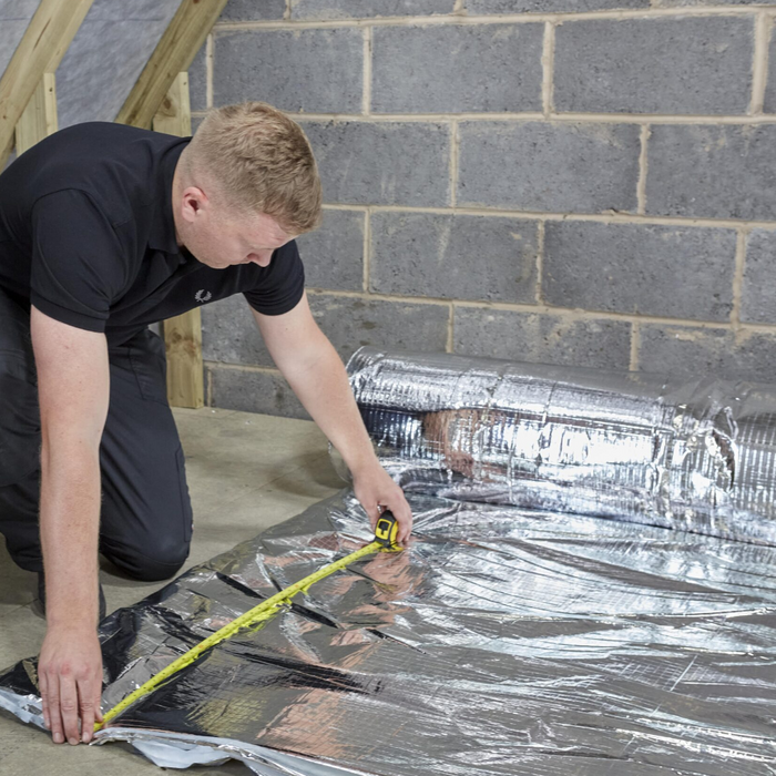 An image of ThermaQuilt Ultra being fitted to the walls in a room