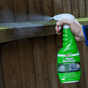 An image of a fence being sprayed with Azpects EASYCare Algae Remover to show it can be used on wood.