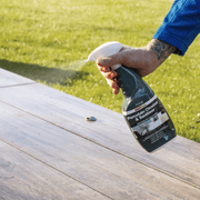An image of azpects EASYCare Porcelain Cleaner and Sanitiser in a spray bottle being used on wood.
