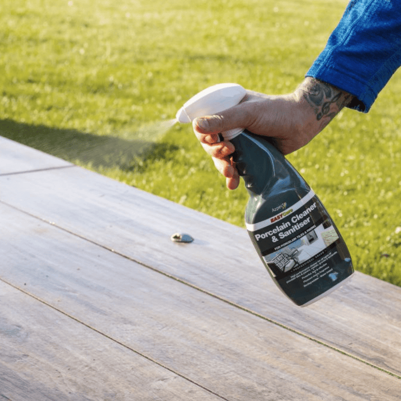 An image of azpects EASYCare Porcelain Cleaner and Sanitiser in a spray bottle being used on wood.