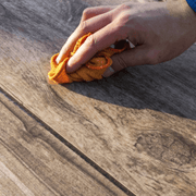 An image of azpects EASYCare Porcelain Cleaner and Sanitiser  being used on wood.