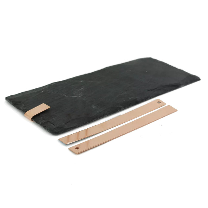 An image showing copper tingles and how they are used on a roofing slate to fix them.