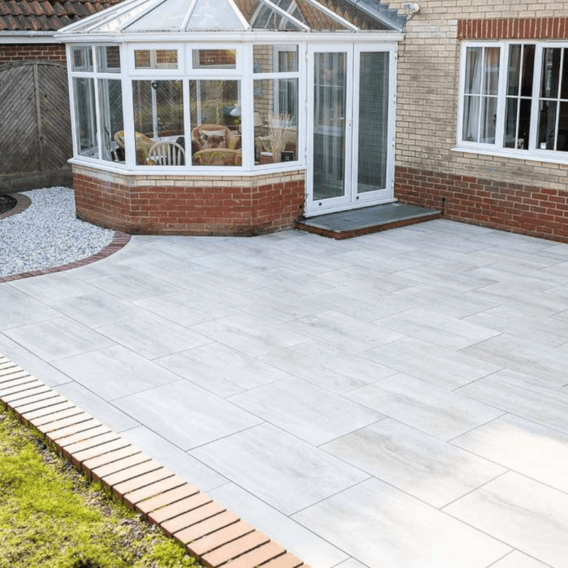 An image of Azpects easy grout porcelain paving slurry being used to fill in the gaps in paving ad how it looks when finished