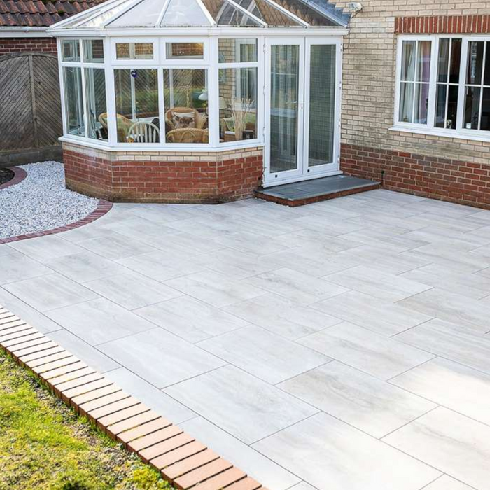 An image of Azpects easy grout porcelain paving slurry being used to fill in the gaps in paving ad how it looks when finished