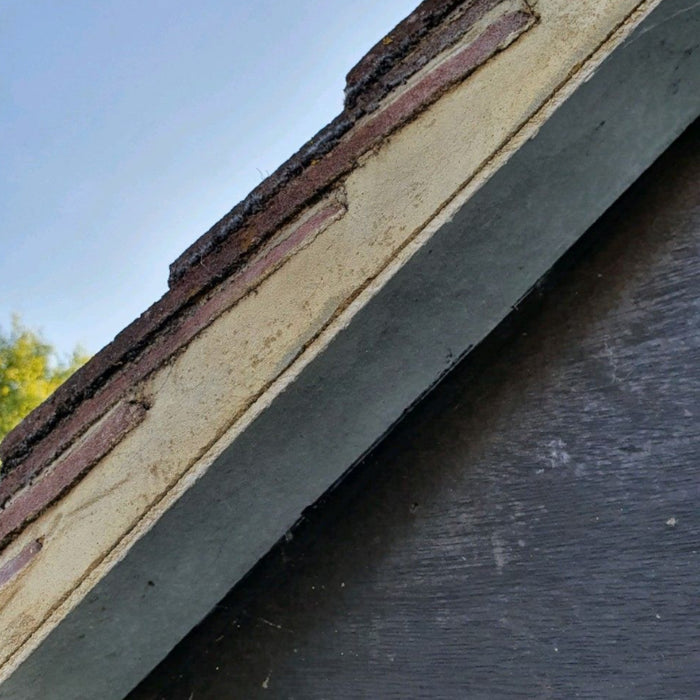 An image of a Fibre Cement strip / Soffit Board / Undercloak and what it looks like when installed on a roof.