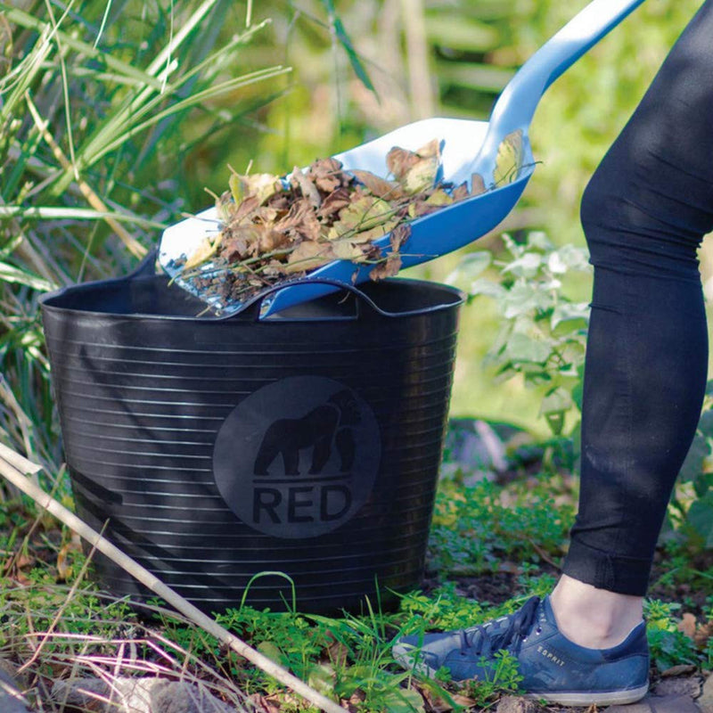 Image of a Red Gorilla Large Tub in Black with a capacity of 38 Litres being loaded up with garden waste such as plants, grass and leaves.