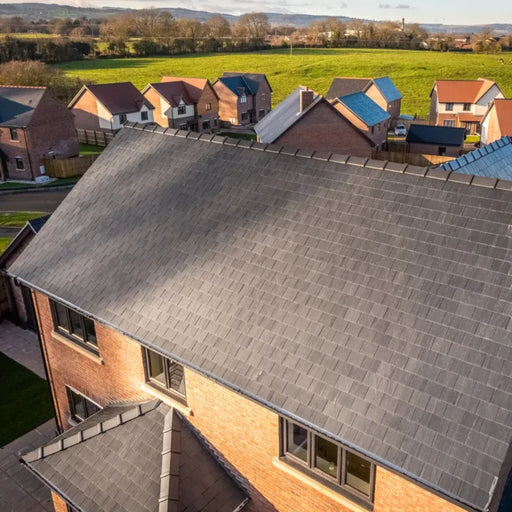 An image of a house with SSQ Del Carmen First Spanish Slates to show what they look like on a finished roof.