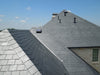 An image of a house roof with SSQ Del Carmen Ultra slate tiles on them to show the finish