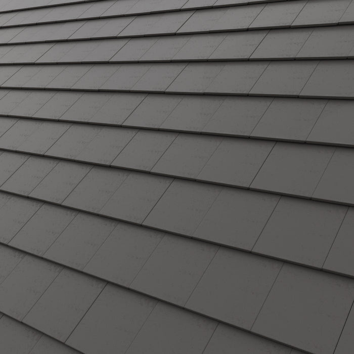 Dark gray Concrete roof tile arranged in overlapping horizontal rows, showing a textured surface 