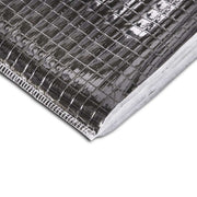 An image of a close up of YBS SuperQuilt Lite Multifoil Insulation . It is silver with a square mesh pattern. The side is cut open to show the white insulation interior.
